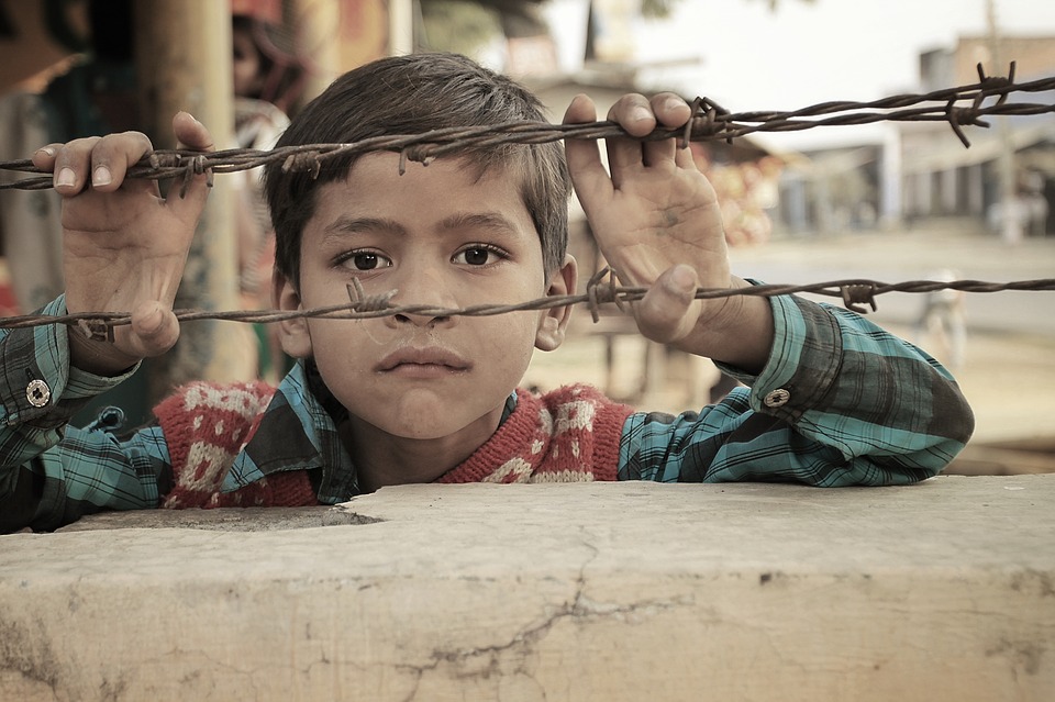 boy holding bulbwire