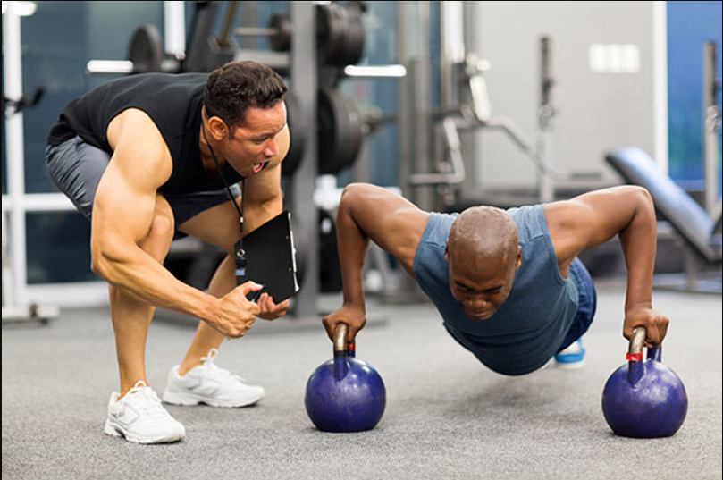 trainer and trainee doing push ups