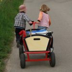 two kids pulling cart