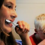 woman brushing teeth